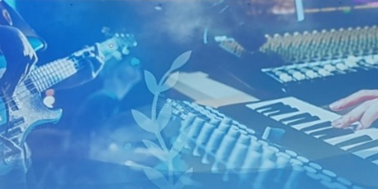 Image of a mixing desk and multiple keyboards being played.