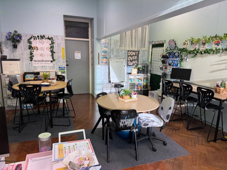image of the hub learning space including tables whiteboard